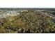 Aerial view of undeveloped land with lush vegetation near residential area at 5703 Tripoli Dr, Palmetto, FL 34221