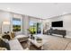 Living room with sectional sofa and sliding glass doors at 5703 Tripoli Dr, Palmetto, FL 34221