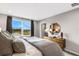 Main bedroom with large window, water view, and stylish mid-century furniture at 5703 Tripoli Dr, Palmetto, FL 34221