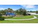 Community playground with modern equipment near a scenic lake at 5703 Tripoli Dr, Palmetto, FL 34221