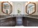 Elegant bathroom with a double vanity and granite countertops at 579 Fore Dr, Bradenton, FL 34208