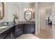 Bathroom with double vanity, granite countertop and view to bedroom at 579 Fore Dr, Bradenton, FL 34208