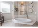 Relaxing bathroom with a large soaking tub and neutral color scheme at 579 Fore Dr, Bradenton, FL 34208