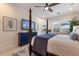 Main bedroom with a post bed, TV, and access to a private balcony at 579 Fore Dr, Bradenton, FL 34208