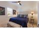 Bedroom with blue bedding, decorative headboard and window with plantation shutters at 579 Fore Dr, Bradenton, FL 34208