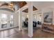 Elegant dining room with a large wooden table, blue chairs, and a statement mirror at 579 Fore Dr, Bradenton, FL 34208