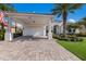 White house with a tiled roof, driveway, and landscaping at 579 Fore Dr, Bradenton, FL 34208