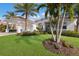 Beautiful home exterior with lush landscaping at 579 Fore Dr, Bradenton, FL 34208