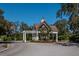 Community entrance with charming guard house and pergola at 579 Fore Dr, Bradenton, FL 34208