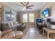 Bright home office featuring a large desk, comfortable seating, and natural light at 579 Fore Dr, Bradenton, FL 34208