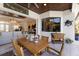 Outdoor dining area with wooden table and chairs, and view of pool at 579 Fore Dr, Bradenton, FL 34208