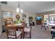 Bright dining area with a table and chairs, and view of living room at 6115 Twig Cir # 6D, Bradenton, FL 34209