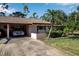 Exterior of condo showing carport and landscaping at 6115 Twig Cir # 6D, Bradenton, FL 34209