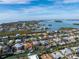 Waterfront home with a canal, pool, and balconies, nestled in a beautiful coastal community with easy access to the bay at 614 Norton St, Longboat Key, FL 34228