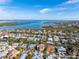 Waterfront home with canal access, pool, and balconies, nestled in a charming coastal community with beautiful water views at 614 Norton St, Longboat Key, FL 34228