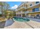 Backyard of home with pool, outdoor seating, and spiral staircase at 614 Norton St, Longboat Key, FL 34228