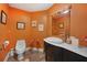 Charming half bathroom with flamingo decor, modern vanity, and oval sink at 614 Norton St, Longboat Key, FL 34228