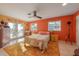 Sunny bedroom with a floral bedspread, French doors, and colorful walls at 614 Norton St, Longboat Key, FL 34228