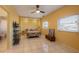 Cozy bedroom with tile flooring, fan, ample natural light, and adjacent bathroom for added convenience and comfort at 614 Norton St, Longboat Key, FL 34228