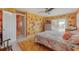 Comfortable bedroom featuring decorative, colorful walls and a plush rug at 614 Norton St, Longboat Key, FL 34228