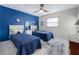 Inviting bedroom with two twin beds, nautical decor, and ample natural light at 614 Norton St, Longboat Key, FL 34228