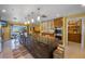 An open kitchen features a large dark island with pendant lighting, double ovens and stainless steel appliances at 614 Norton St, Longboat Key, FL 34228