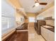 Well-lit laundry room featuring a modern washer/dryer, storage cabinets, and functional folding area with lots of sunshine at 614 Norton St, Longboat Key, FL 34228