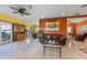 Bright living room with tile floors, comfortable leather seating, and an open floor plan at 614 Norton St, Longboat Key, FL 34228