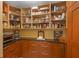 A large walk-in pantry provides generous storage with counter space and drawers at 614 Norton St, Longboat Key, FL 34228