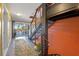 Hallway featuring a staircase that leads up to the next level. Nice balcony at the end of the hallway at 614 Norton St, Longboat Key, FL 34228