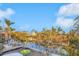 Waterfront view featuring boat dockage and tropical landscaping surrounding the property at 614 Norton St, Longboat Key, FL 34228