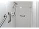 Clean shower with grab bars and tiled walls at 6304 Pointe West Blvd # A206, Bradenton, FL 34209