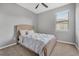 Cozy bedroom with wicker bed frame and neutral decor at 6534 Clairborne Ln, Lakewood Ranch, FL 34211