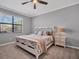 Main bedroom with ceiling fan and large window at 6534 Clairborne Ln, Lakewood Ranch, FL 34211