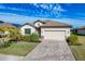 One-story home with a two-car garage and landscaped yard at 6534 Clairborne Ln, Lakewood Ranch, FL 34211