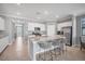 Modern kitchen with island, white cabinets, and stainless steel appliances at 6534 Clairborne Ln, Lakewood Ranch, FL 34211