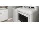 Stackable washer and dryer in a convenient laundry room at 6534 Clairborne Ln, Lakewood Ranch, FL 34211