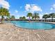 Community pool with a large deck and surrounding landscaping at 6534 Clairborne Ln, Lakewood Ranch, FL 34211