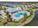 Aerial view of community pool, clubhouse, and playground at 6534 Clairborne Ln, Lakewood Ranch, FL 34211