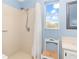 Simple bathroom with a shower/tub combo and window at 6950 42Nd E Ct, Sarasota, FL 34243