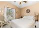 Bedroom featuring a comfortable bed and wicker chair at 6950 42Nd E Ct, Sarasota, FL 34243