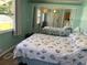 Bright bedroom with a seashell bedding and mirrored closet at 712 51St Avenue W Ter, Bradenton, FL 34207