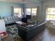 Comfortable living room featuring multiple seating areas and a large rug at 712 51St Avenue W Ter, Bradenton, FL 34207