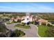 Aerial view of a luxurious clubhouse with a golf course and landscaped grounds at 7121 Orchid Island Pl, Bradenton, FL 34202