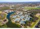 Aerial view of community tennis courts, clubhouse, and lake at 7121 Orchid Island Pl, Bradenton, FL 34202