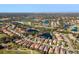 Aerial view of home in community with lake at 7121 Orchid Island Pl, Bradenton, FL 34202