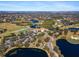 Aerial view of a large clubhouse, golf course, and surrounding community at 7121 Orchid Island Pl, Bradenton, FL 34202