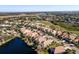 Aerial view of community with golf course and lake at 7121 Orchid Island Pl, Bradenton, FL 34202