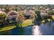 Aerial view of homes and canal with lush landscaping at 7121 Orchid Island Pl, Bradenton, FL 34202