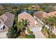 Aerial view of single-Gathering home with tile roof, landscaping, and driveway at 7121 Orchid Island Pl, Bradenton, FL 34202